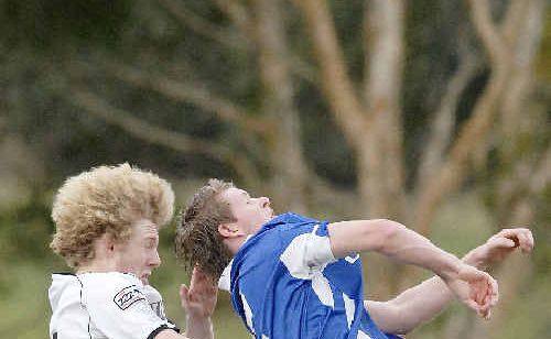 Byron Bay’s Tim Knight (left) jumps for the ball against Thistles in Lismore on Saturday. Thistles won 4-2. Byron Bay’s Tim Knight (left) jumps for the ball against Thistles in Lismore on Saturday. Thistles won 4-2.